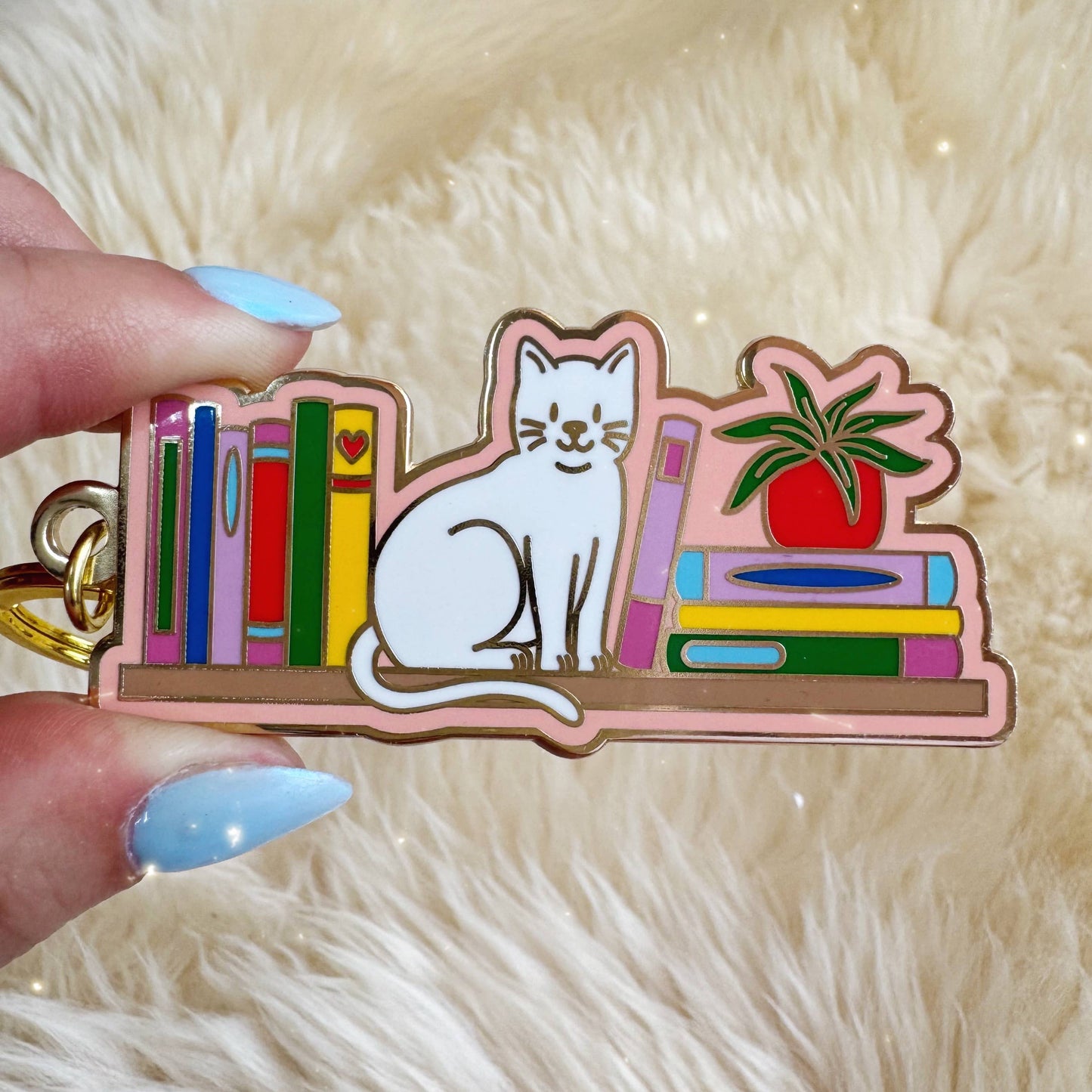 Cat Bookshelf Enamel Keychain: Packaged