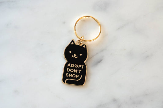 Adopt Don't Shop Keychain: Black/gold