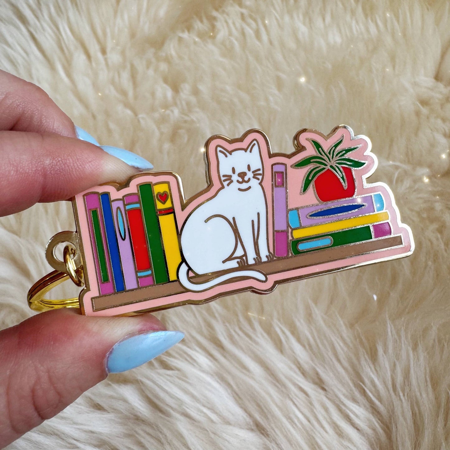 Cat Bookshelf Enamel Keychain: Packaged