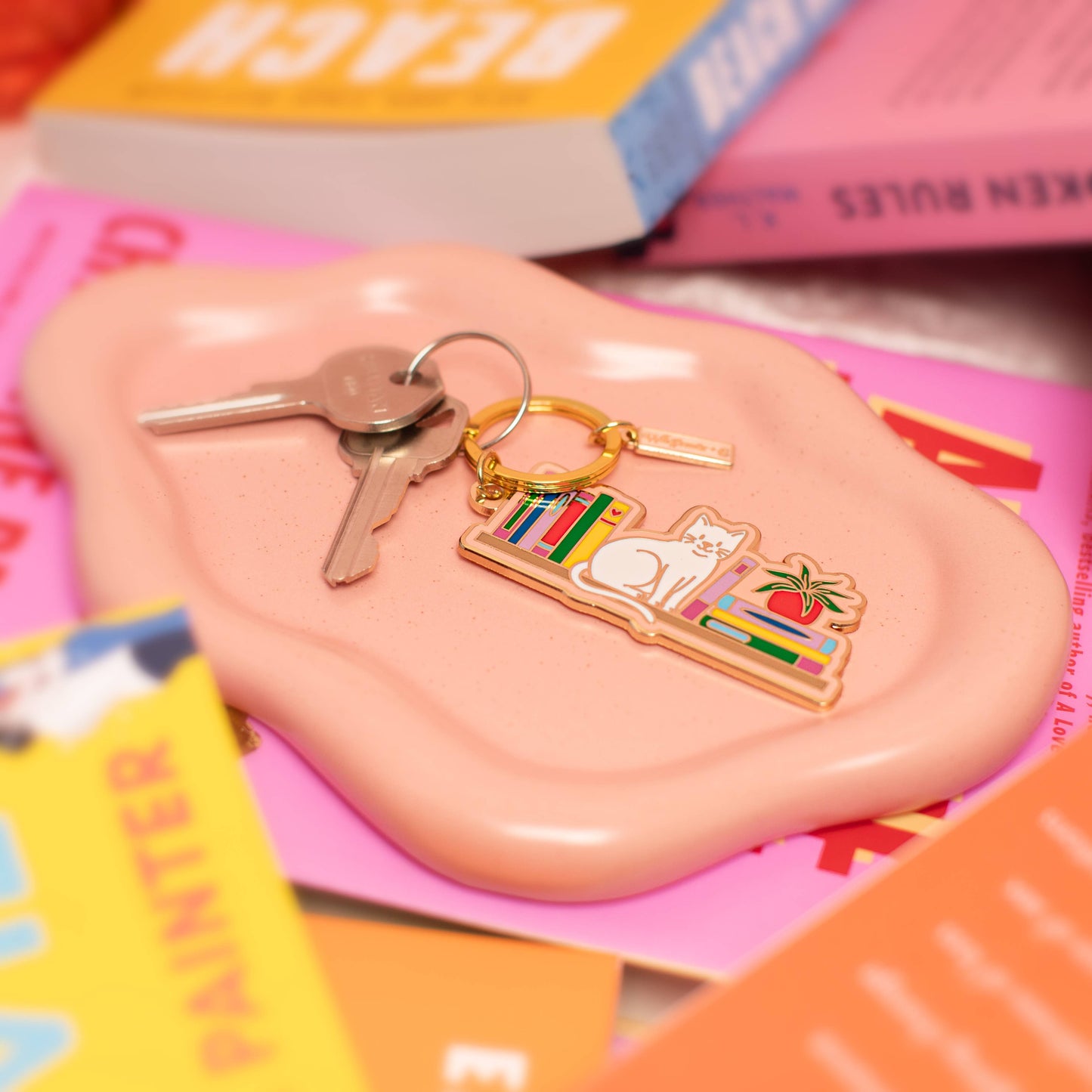 Cat Bookshelf Enamel Keychain: Packaged