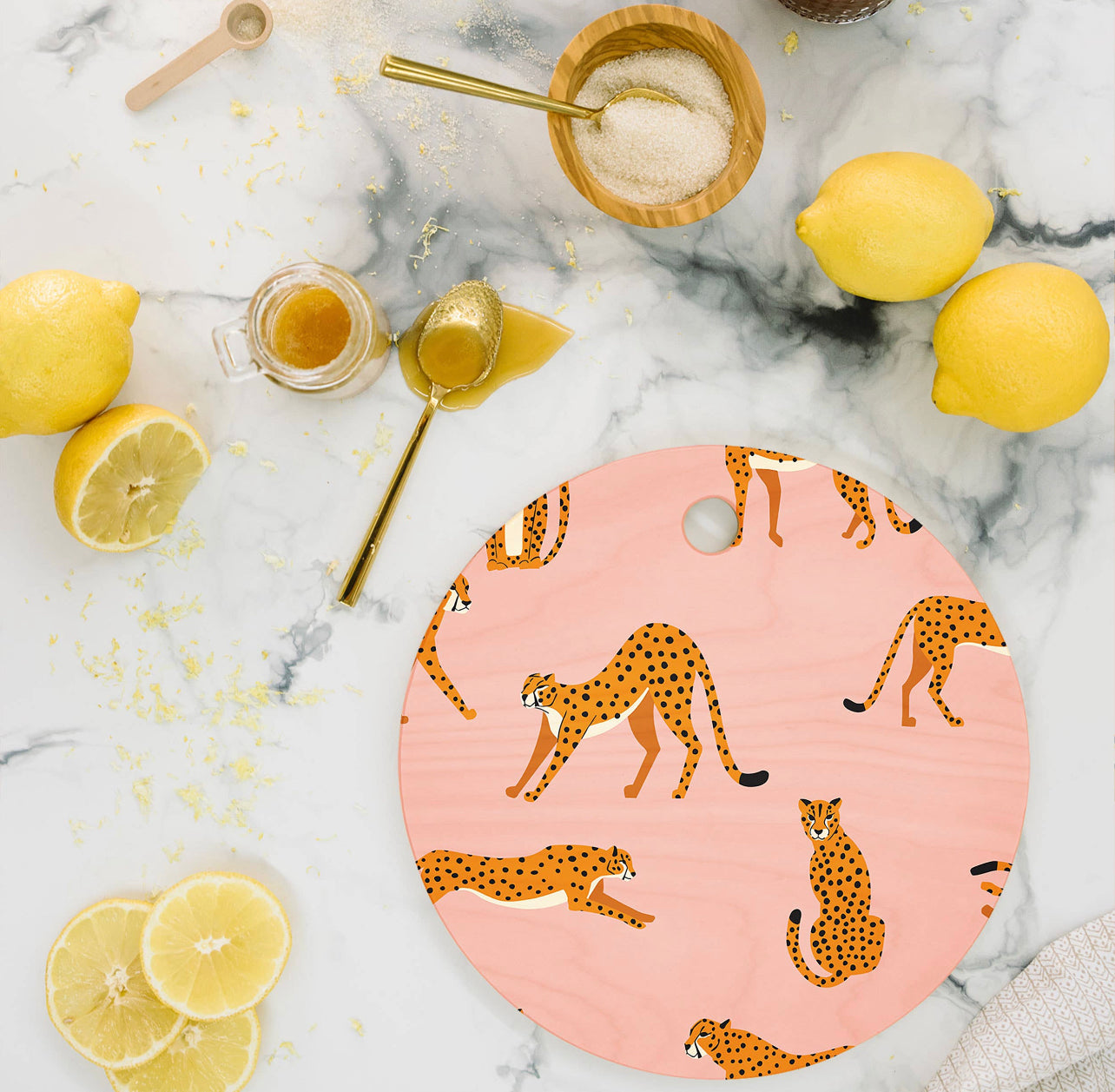 BlueLela Cheetahs Pink Round Cutting Board | Deny Designs