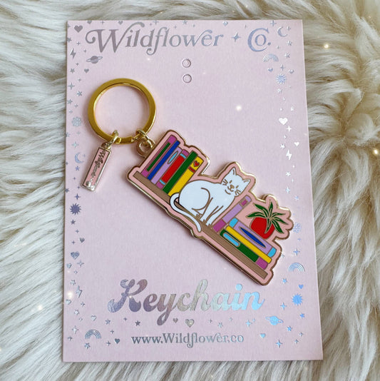 Cat Bookshelf Enamel Keychain: Packaged